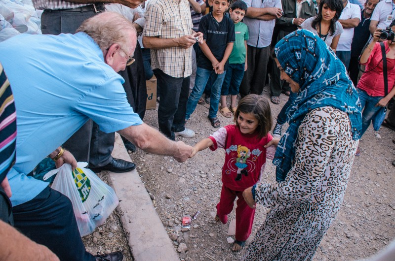 Terry Law giving food to Syrian refugees in Kurdistan, Iraq